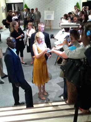 Kirsten Dunst Signs Autographs for Fans After Melancholia Press Conference